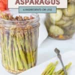 A mason jar brimming with zesty pickled asparagus, proudly showcasing a quick recipe crafted with six ingredients or less. In the background, a plate displays this savory delight alongside a classic jar of pickles.