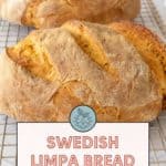 Two loaves of fragrant Swedish Limpa bread rest on a cooling rack. Text overlay reads: "Limpa Bread: fragrant and tender.