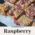 Close-up of raspberry pie bars with a crumb topping on parchment paper. The text reads, "Raspberry Pie Bars - Easy Summer Dessert." Perfect to enjoy after a delightful roasted corn salad.