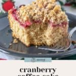 A fork next to a piece of cranberry coffee cake topped with pecan streusel on a plate. Text overlay reads, "stetted" and "cranberry coffee cake with pecan streusel.