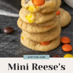 A delightful stack of mini Reese's Pieces cookies sits alongside a scattering of colorful candies, inviting you to indulge.