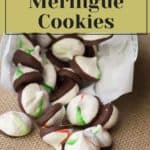 A delightful cascade of chocolate-dipped peppermint meringue cookies spills from a paper bag, tempting with their sweet aroma.