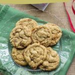 A plate of irresistible salted caramel cashew cookies rests on a green napkin, inviting you to explore this delicious recipe.