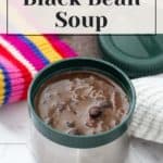 A container of black bean soup, accompanied by a colorful striped cloth and a green lid. The text reads, "How to Make Black Bean Soup," with a logo at the bottom.