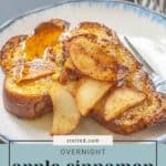 A plate of overnight apple cinnamon French toast with slices of apple on top, placed on a table.