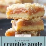 A close-up of apple pie bars with a crumbly top layer, a middle apple filling layer, and a cookie base. Text overlay reads, "Fall Dessert: Crumble Apple Pie Bars. stetted.com.