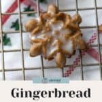 Close-up of decorated gingerbread spritz cookies shaped like stars on a cooling rack. Text at the bottom reads "Gingerbread Spritz Cookies: Easy Cookie Recipe." Perfect for any dessert table alongside apple pie bars.