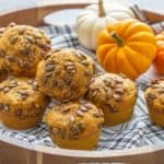 tray of pumpkin muffins with a plaid napkin