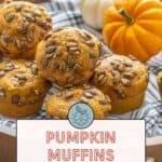 A wooden tray with pumpkin muffins topped with pepitas and a small white and orange pumpkin for decoration. Text reads, "Delicious Pumpkin Muffins with Pepitas. Get the recipe at stetted.com.