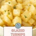 A bowl of beautifully glazed turnips garnished with fresh herbs. Text overlay reads, "Glazed Turnips, easy side dish. Get the recipe at stetted.com.