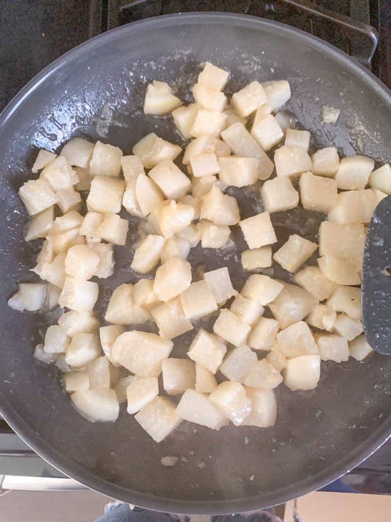 cooked glazed turnips in saute pan