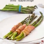 Plate with bacon-wrapped asparagus spears, a delightful combination of savory and fresh. In the background, a bunch of vibrant asparagus stands ready. Text reads: "BACON WRAPPED ASPARAGUS oven-baked recipe. Get the recipe at stetted.com".