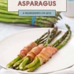 A plate displays three bacon-wrapped asparagus stalks, while fresh asparagus adds a vibrant backdrop. A sign proudly declares, "Bacon Wrapped Asparagus, 4 Ingredients or Less.