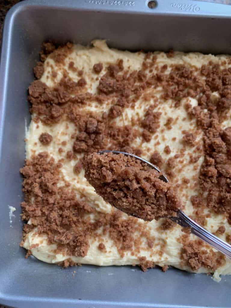 adding streusel to coffee cake batter