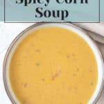 A bowl of creamy, spicy corn soup is centered in the image. Text above the bowl reads, "How to Make Spicy Corn Soup with Quick Pickled Cucumbers," with a website URL "stetted.com" at the bottom.