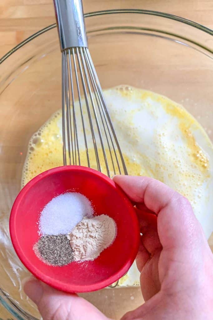 adding spices to quiche filling