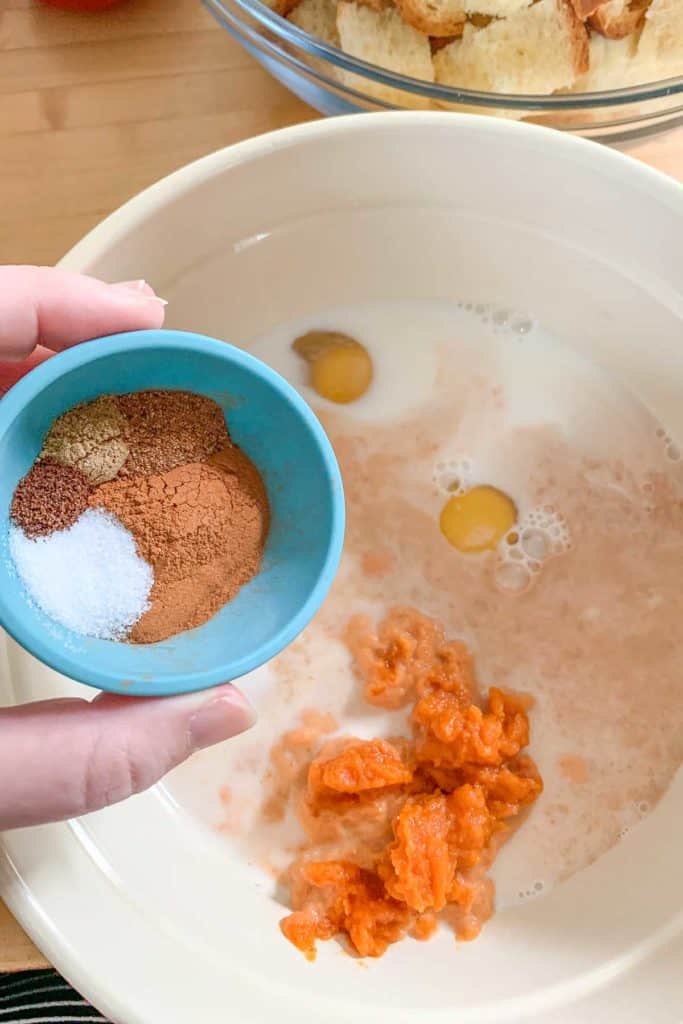 adding spices to pumpkin french toast custard