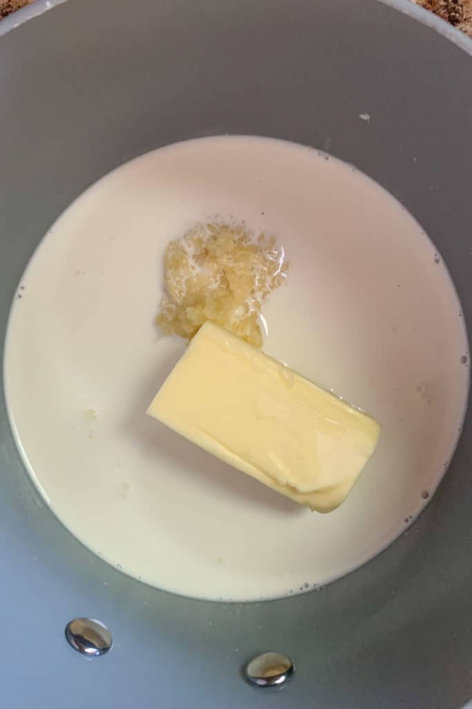 cream, butter, and garlic in a saucepan