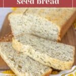 Slices of lemon poppy seed bread rest invitingly on a wooden board, complemented by a patterned cloth and the elegant label "lemon poppy seed bread" at the top.