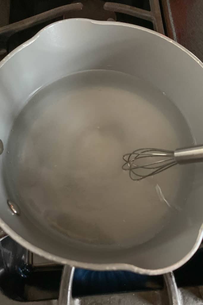 Saucepan with ingredients for pickling brine being heated.