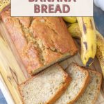 A loaf of banana bread sits on a wooden board, surrounded by sliced pieces and ripe bananas. The text reads "Super Easy & Moist Banana Bread Recipe.