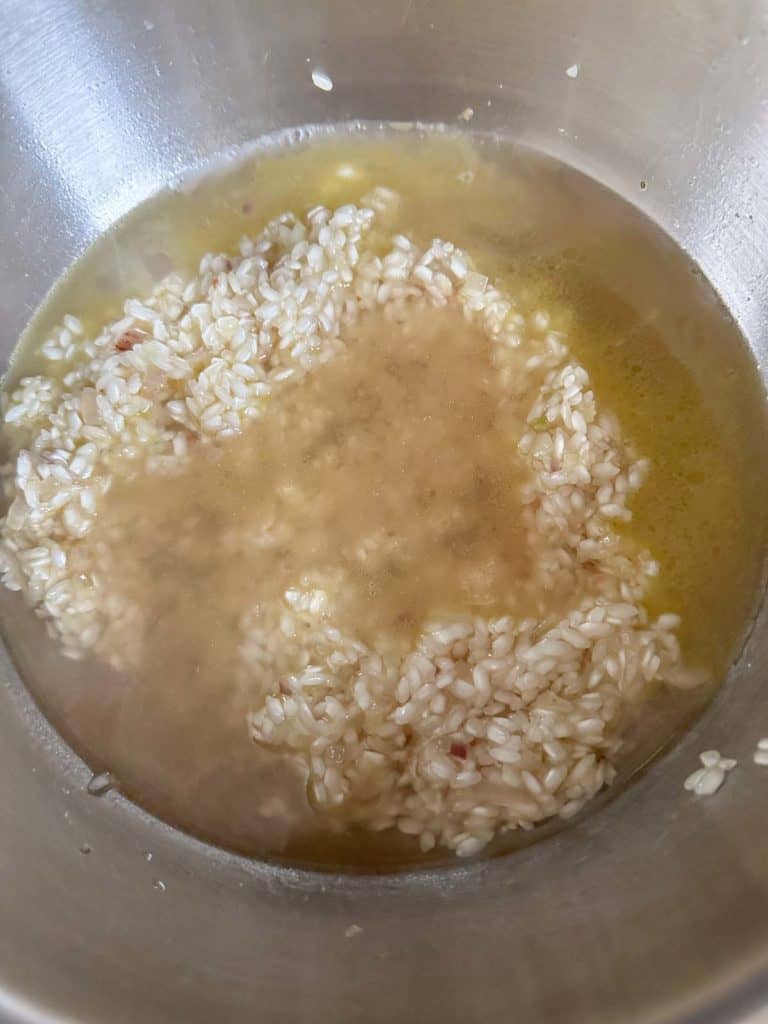 Broth added to rice for risotto.