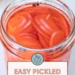 A jar of sliced pickled radishes in tangy red brine, seasoned to perfection and labeled "Easy Pickled Radishes.