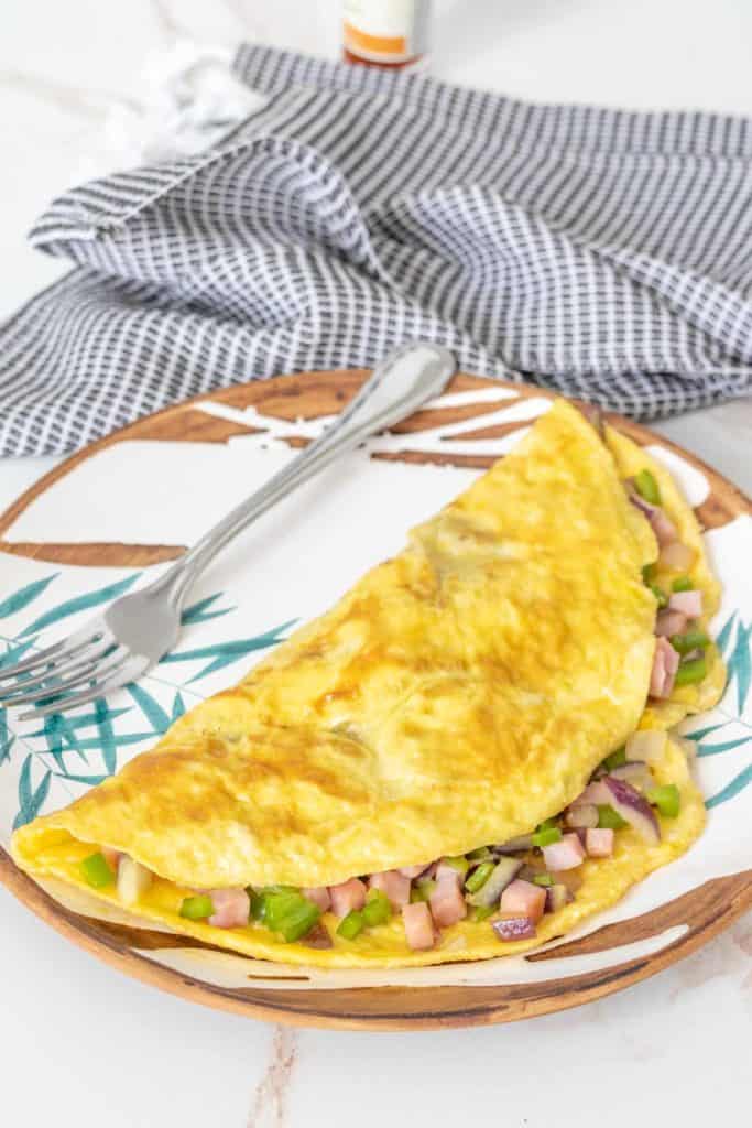 Denver omelet on a leaf patterned plate.