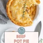 A top-down view of a partially eaten beef pot pie with a flaky crust. A knife and striped cloth are next to the dish. A text overlay reads: "Delicious Beef Pot Pie with flaky crust. Get the recipe at stetted.com".