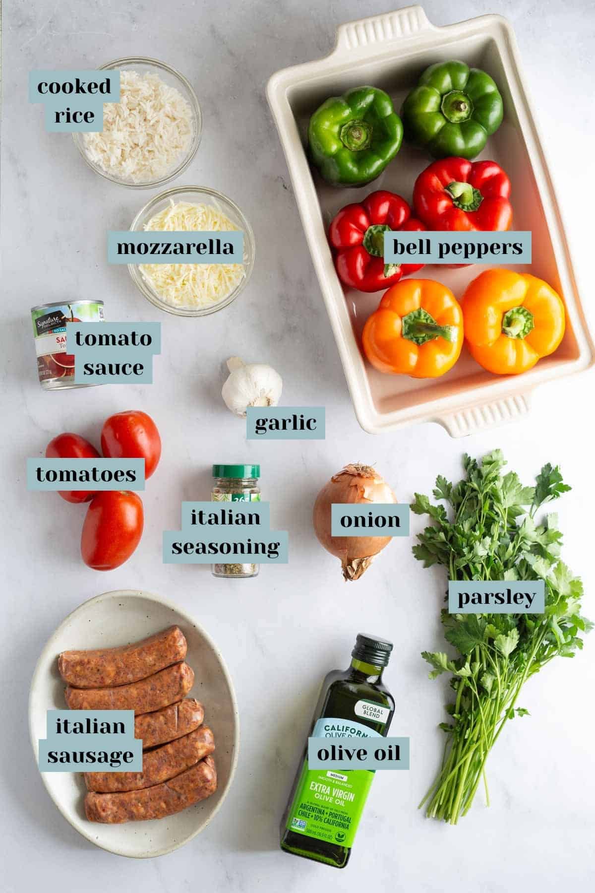 Assorted ingredients for cooking arranged on a surface, including cooked rice, vegetables, Italian sausage, and spices, labeled with their names.