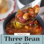 A spoon holding three bean chili above a bowl, with text overlay reading "Three Bean Chili: Quick Vegan Recipe," perfect for when you need a hearty meal before indulging in some birthday cupcakes.