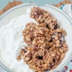 A bowl of yogurt topped with homemade chocolate granola. Text reads "homemade CHOCOLATE GRANOLA" at the top and "stetted.com" at the bottom.