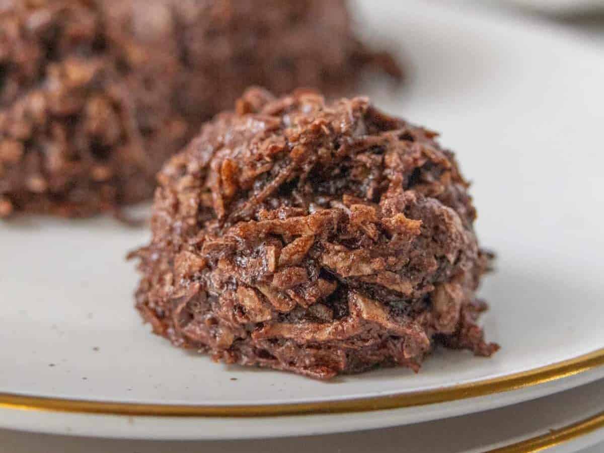 Chocolate macaroons on a plate.