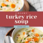 Two bowls of creamy turkey rice soup with carrots and herbs are shown, surrounded by a cloth and a spoon on a wooden plate.