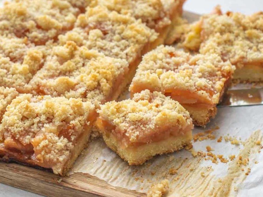 sliced apple pie bars on cutting board