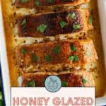 Four pieces of honey-glazed salmon garnished with herbs in a baking dish. Text reads "Honey Glazed Salmon. Get the recipe at stetted.com.