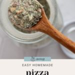 Wooden spoon scooping homemade pizza seasoning from a jar. Text below reads "Easy Homemade Pizza Seasoning.