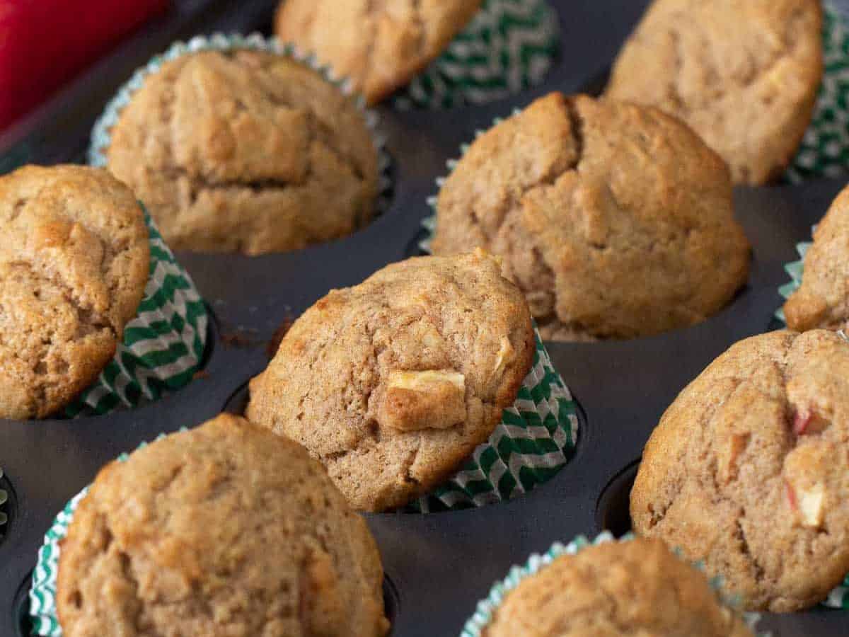 apple cinnamon muffins in muffin tin