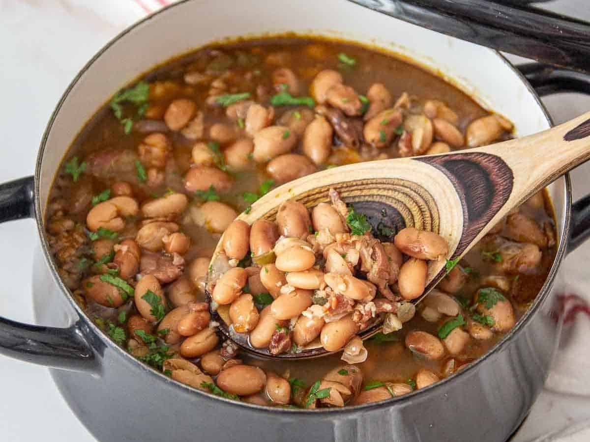 borracho beans in pot with spoon