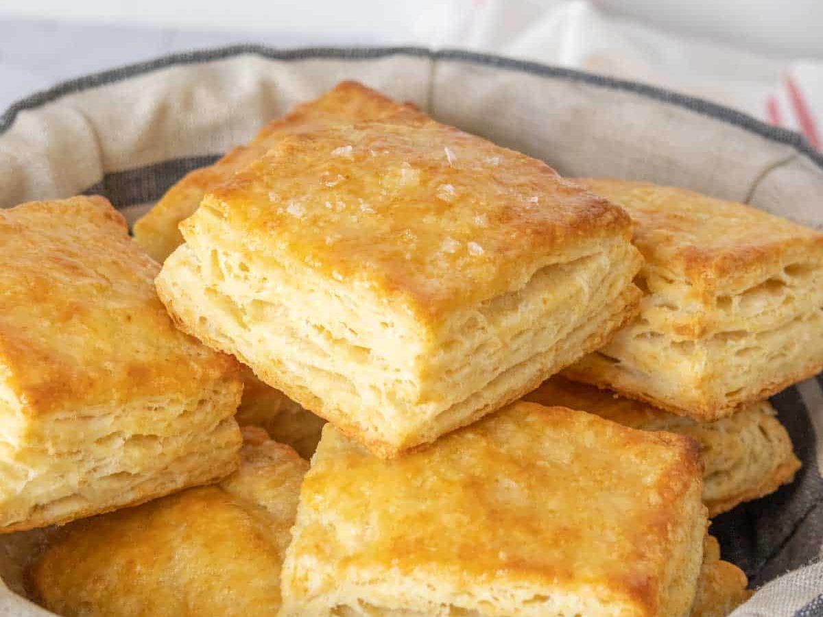 Bowl of buttermilk biscuits stacked.