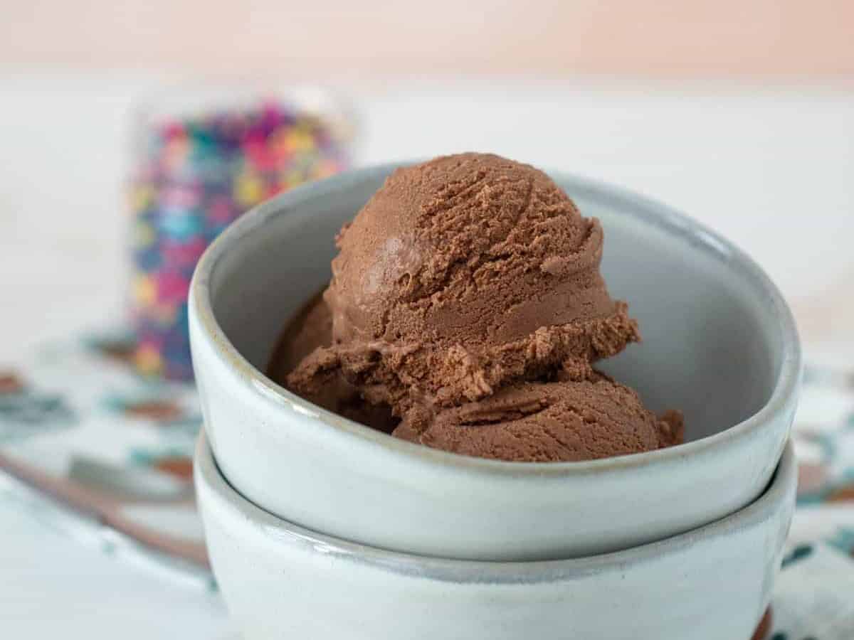 stacked bowls with chocolate ice cream in top bowl