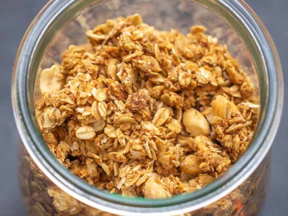 overhead peanut butter granola in a glass jar