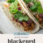 Two blackened salmon tacos with cilantro and lime on a plate, accompanied by the text "Quick & Easy Blackened Salmon Tacos.