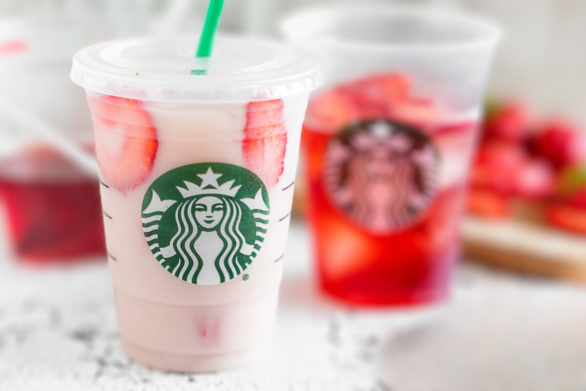 Homemade pink drink in a disposable cup.