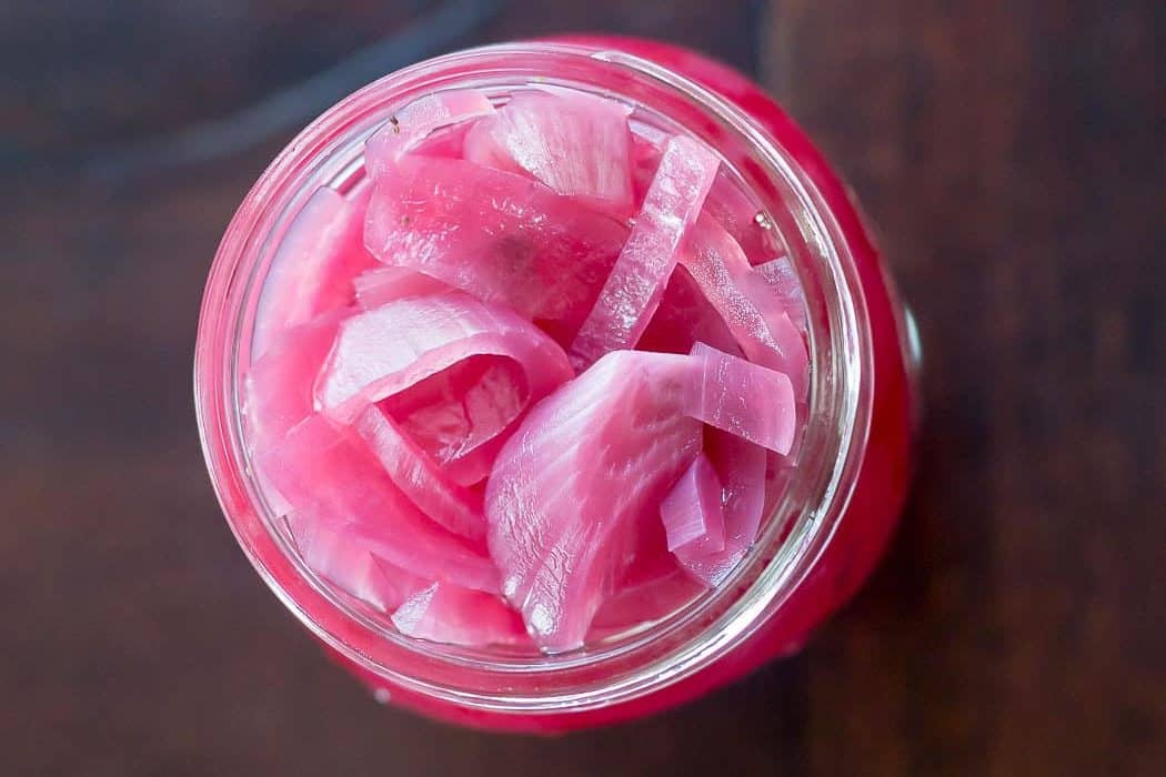 Tangy pickled red onions add so much flavor to tacos, burgers, and more.