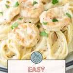 A plate of creamy shrimp pasta garnished with parsley. Text overlay reads "Easy Shrimp Pasta. Get the recipe at stetted.com.