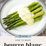 A plate of asparagus topped with beurre blanc sauce, placed on a wooden surface. Text reads: "How to Make Beurre Blanc Sauce.