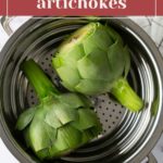 Two fresh artichokes in a metal steamer basket, with a text overlay reading "how to cook artichokes" at the top.